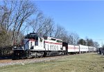  TFT train crossing Lawlins Road at track speed with SD40-2 # 3024 in the heritage colors leading